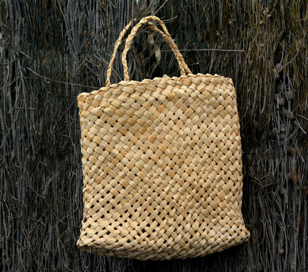 Woven flax bag (close up ) traditional Maori culture artwork New Zealand.